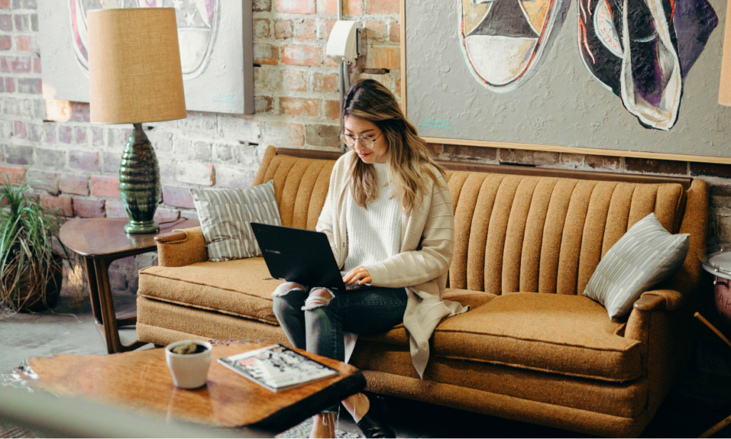 Woman working from home couch